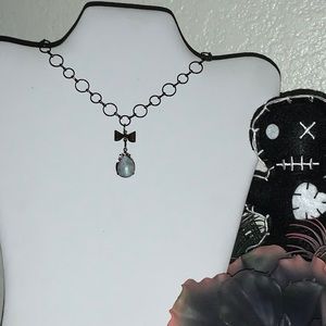 Authentic Moonstone in Noir Brass Setting & Bow Drop on Black Loop Chain Choker